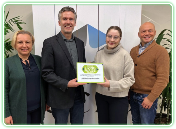 Photo of OCAS employees receiving Ontario Living Wage Employer award 